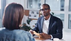 Business consultation with a professional advisor in a modern office setting. {{brizy_dc_image_alt imageSrc=